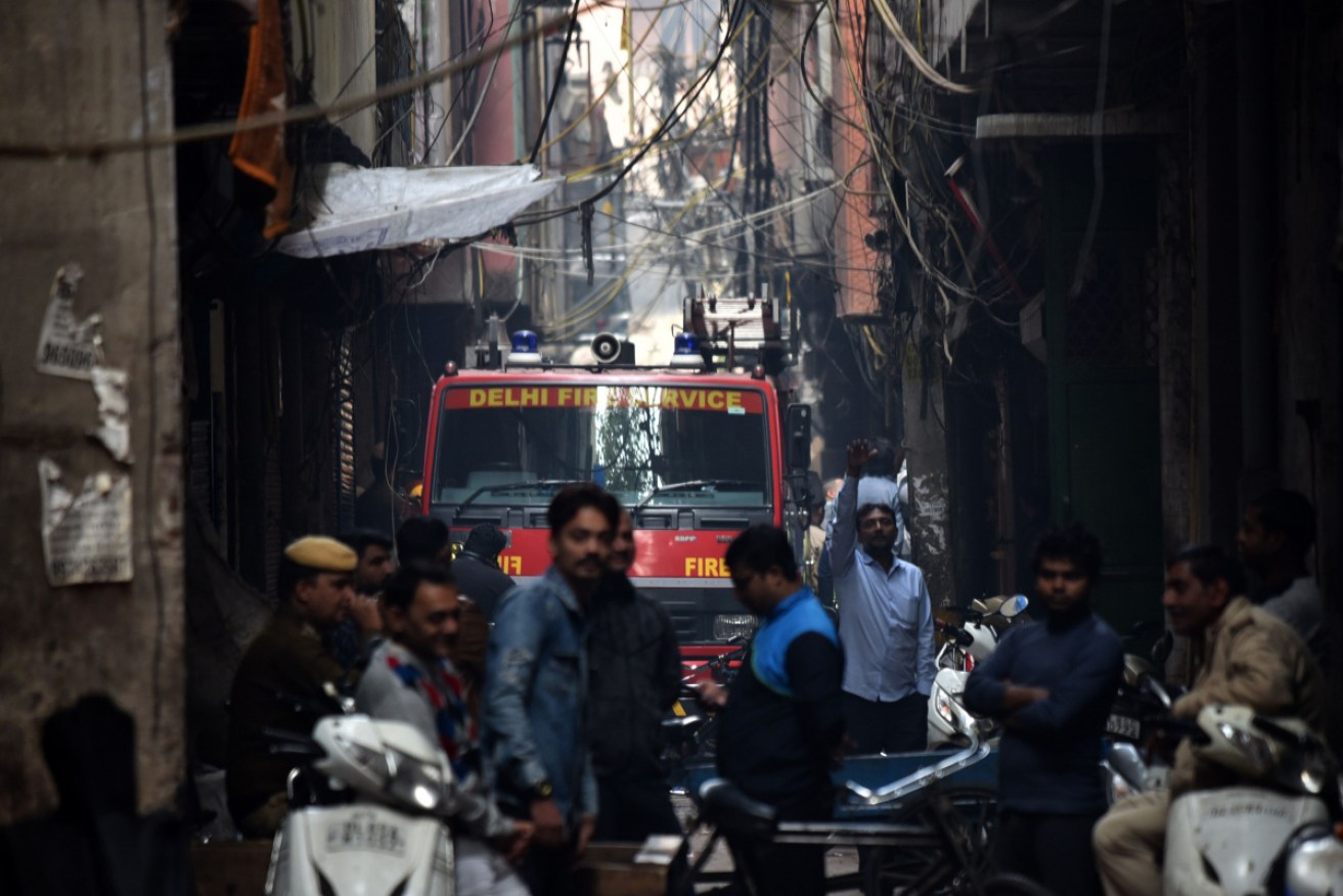 A Delhi Fire Service truck near the site of a deadly factory in the Anaj Mandi area of New Delhi on Sunday. 