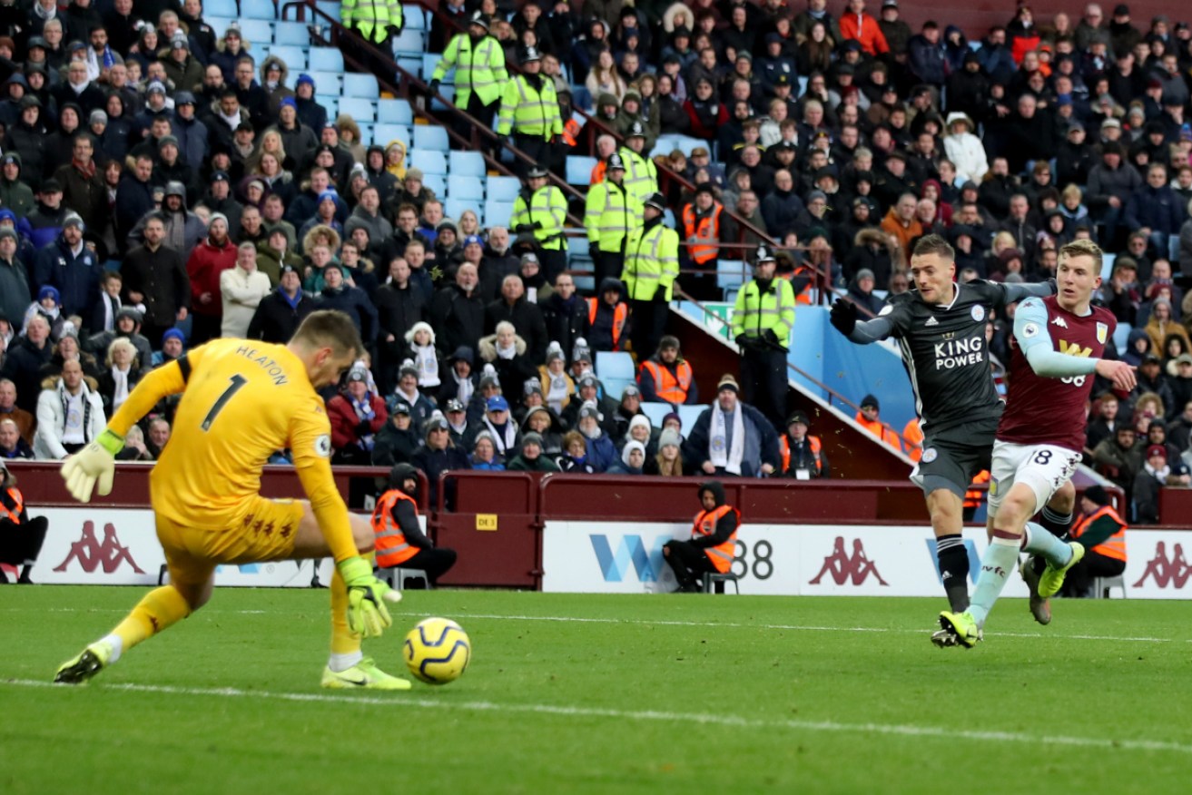 Jamie Vardy slots Leicester's fourth goal against Aston Villa.