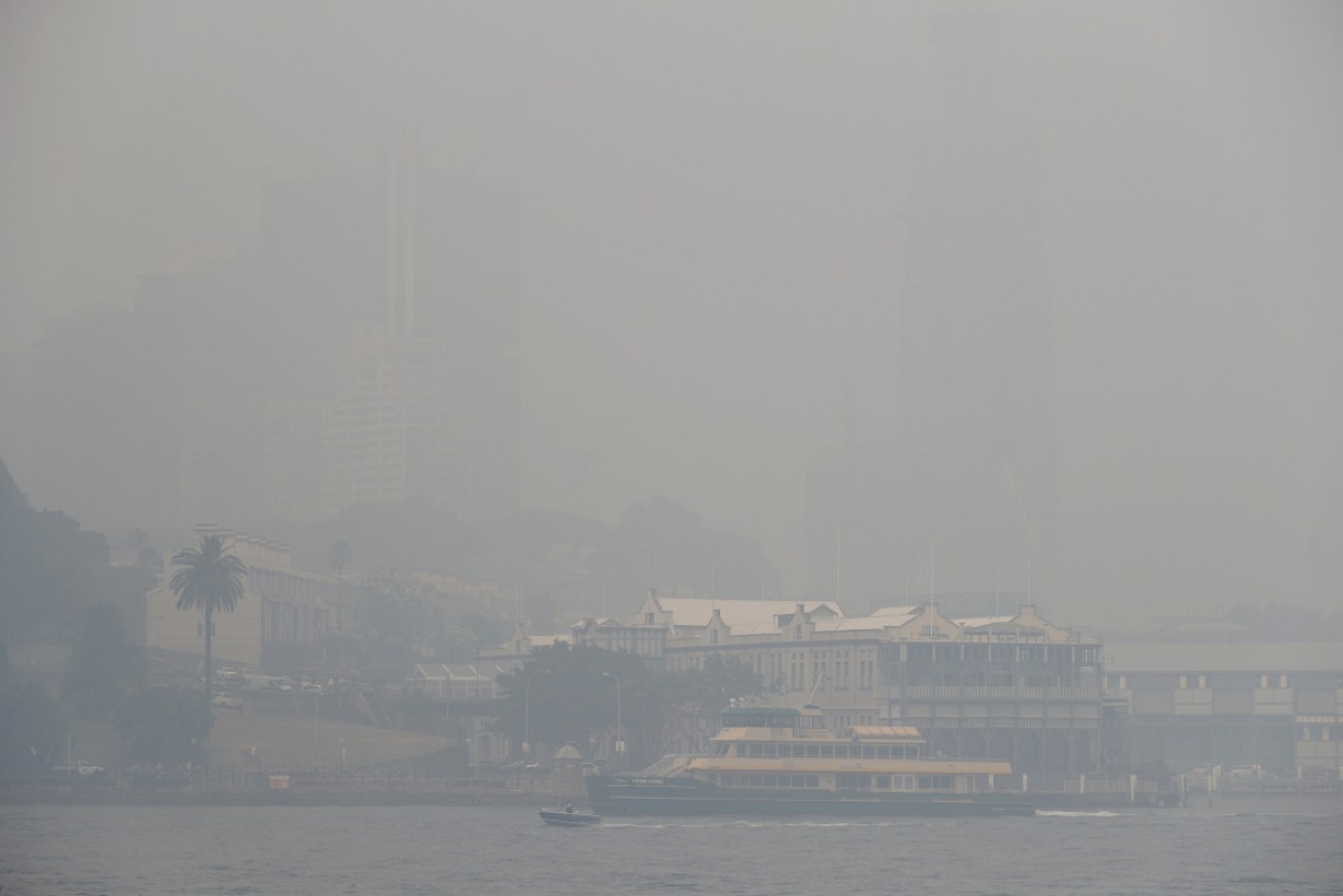 A ferry on Sydney Harbour amid thick smoke on Tuesday morning.