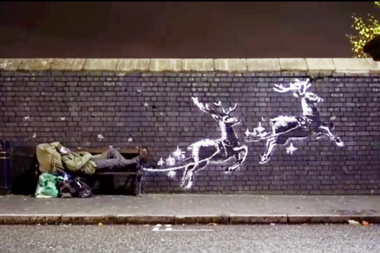 A new mural by elusive artist Banksy shows flying reindeer to highlight the plight of homeless people at Christmas.