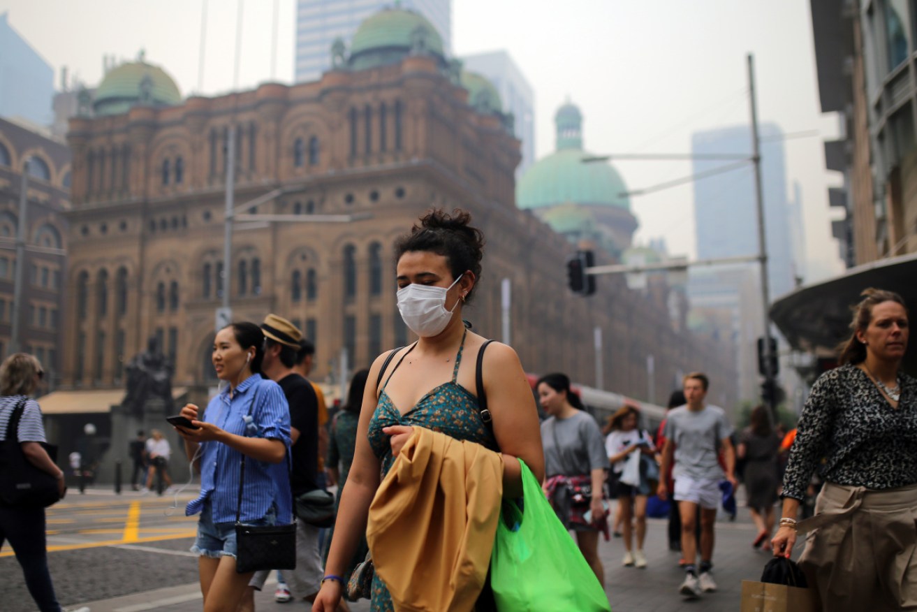 Some people in Sydney are wearing masks to cope with the smoke haze, but health experts say it's better to just stay inside. 