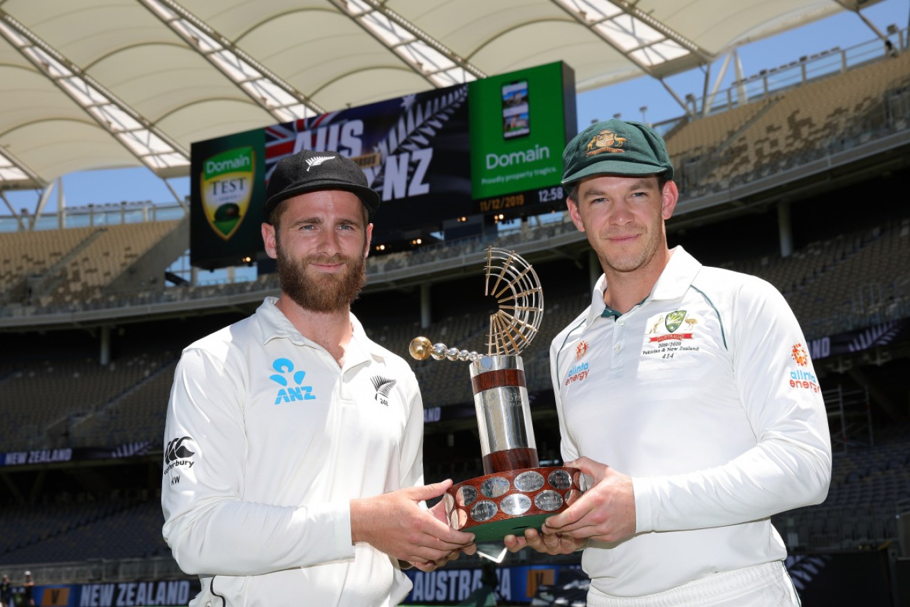 Black Caps' captain Kane Williamson and Australian skipper Tim Paine with the trophy for the three-Test series. 