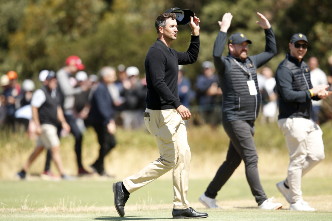 Adam Scott waves to the gallery on the 18th hole on day one of the Presidents Cup at Royal Melbourne on Thursday.