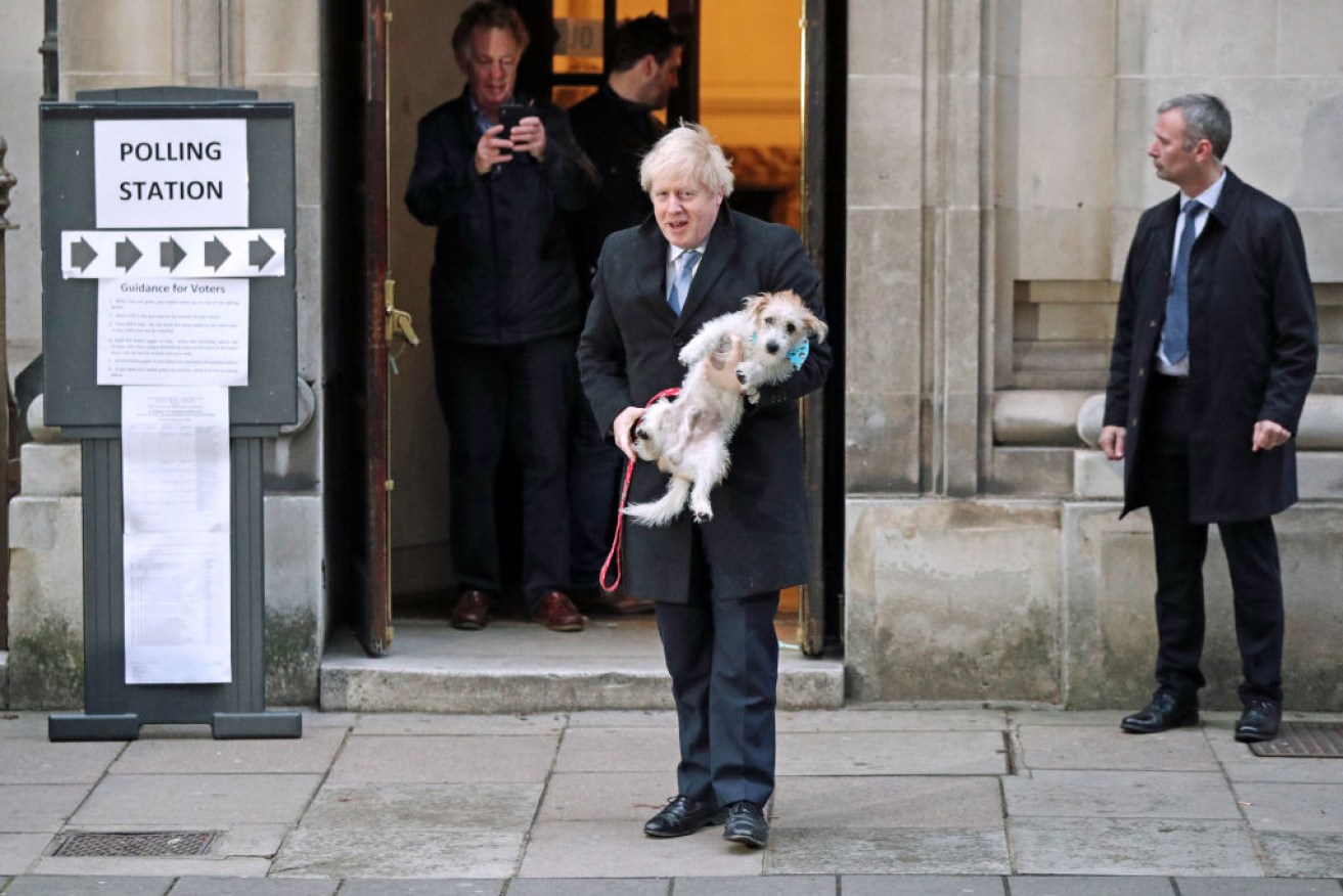 UK Prime Minister Boris Johnson has cast his  vote outside his own electorate with his rescue dog Dilyn.