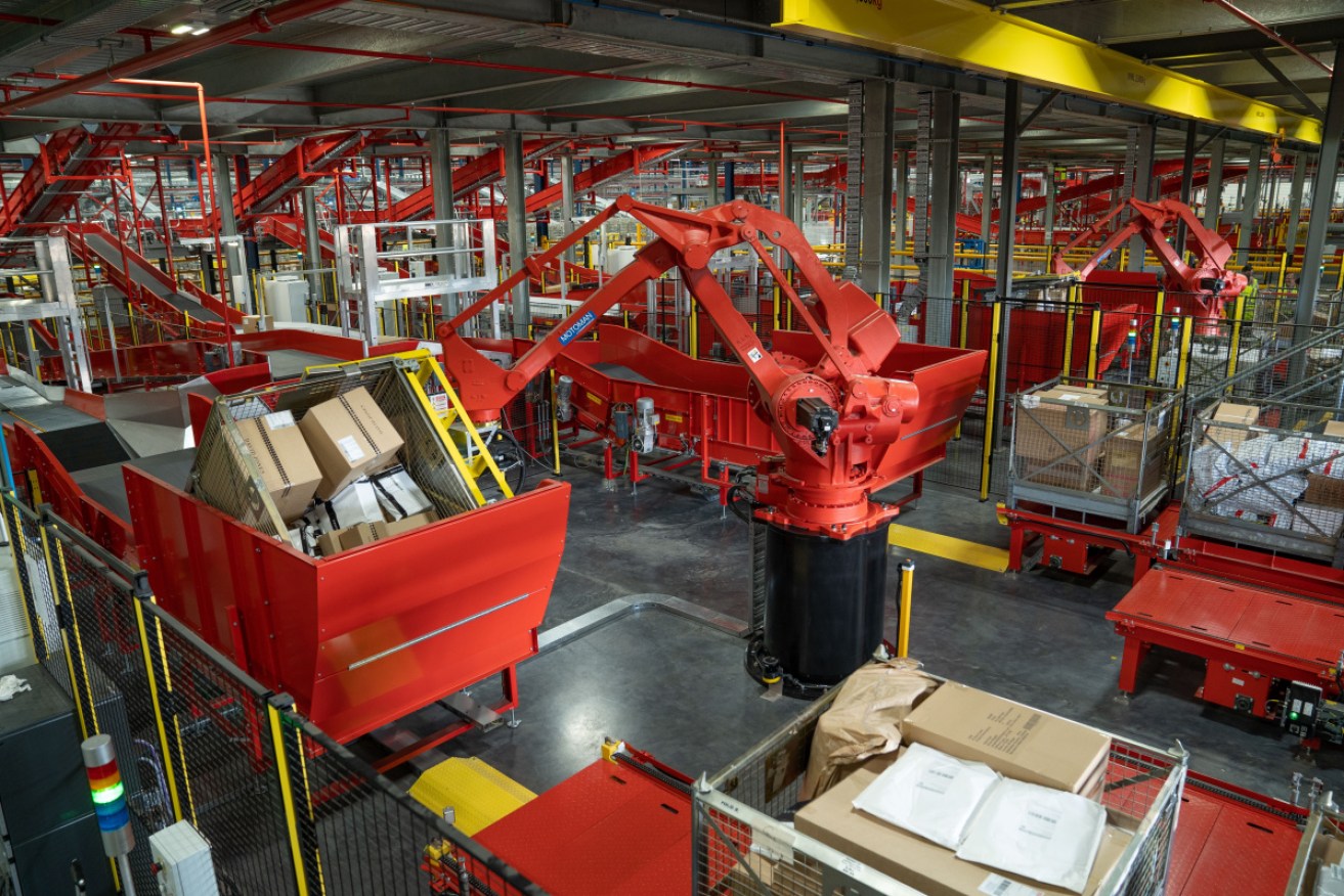 Australia Post's processing centre at Redbank will help with Monday's bumper delivery day.