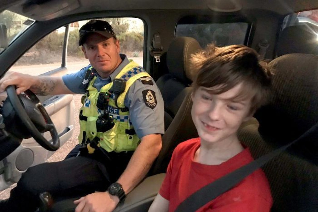 Lucas Sturrock (right) was found by police after driving across paddocks to escape a bushfire.