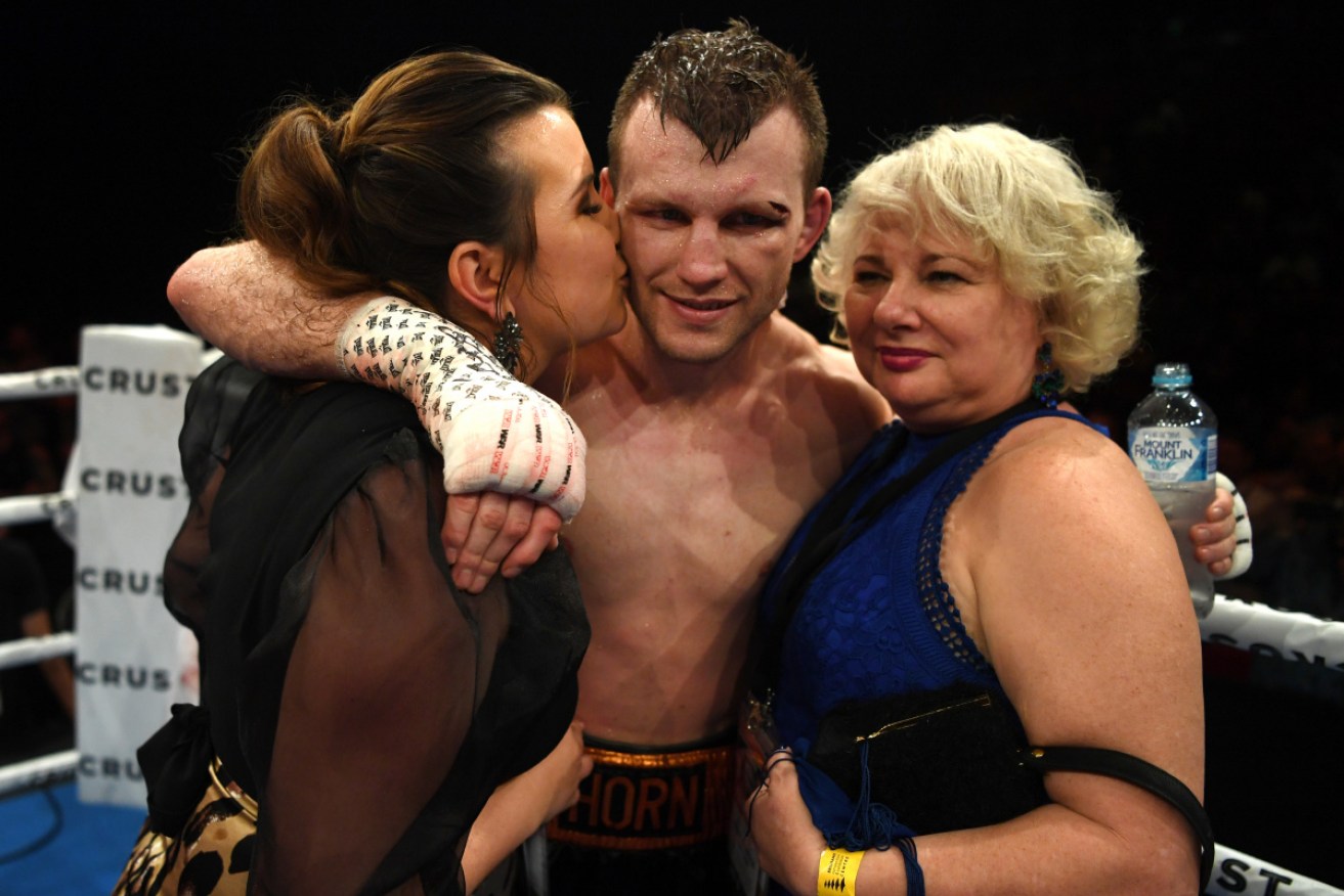 Jeff Horn celebrates victory with his wife Jo and mother Liza after defeating Michael Zerafa. 