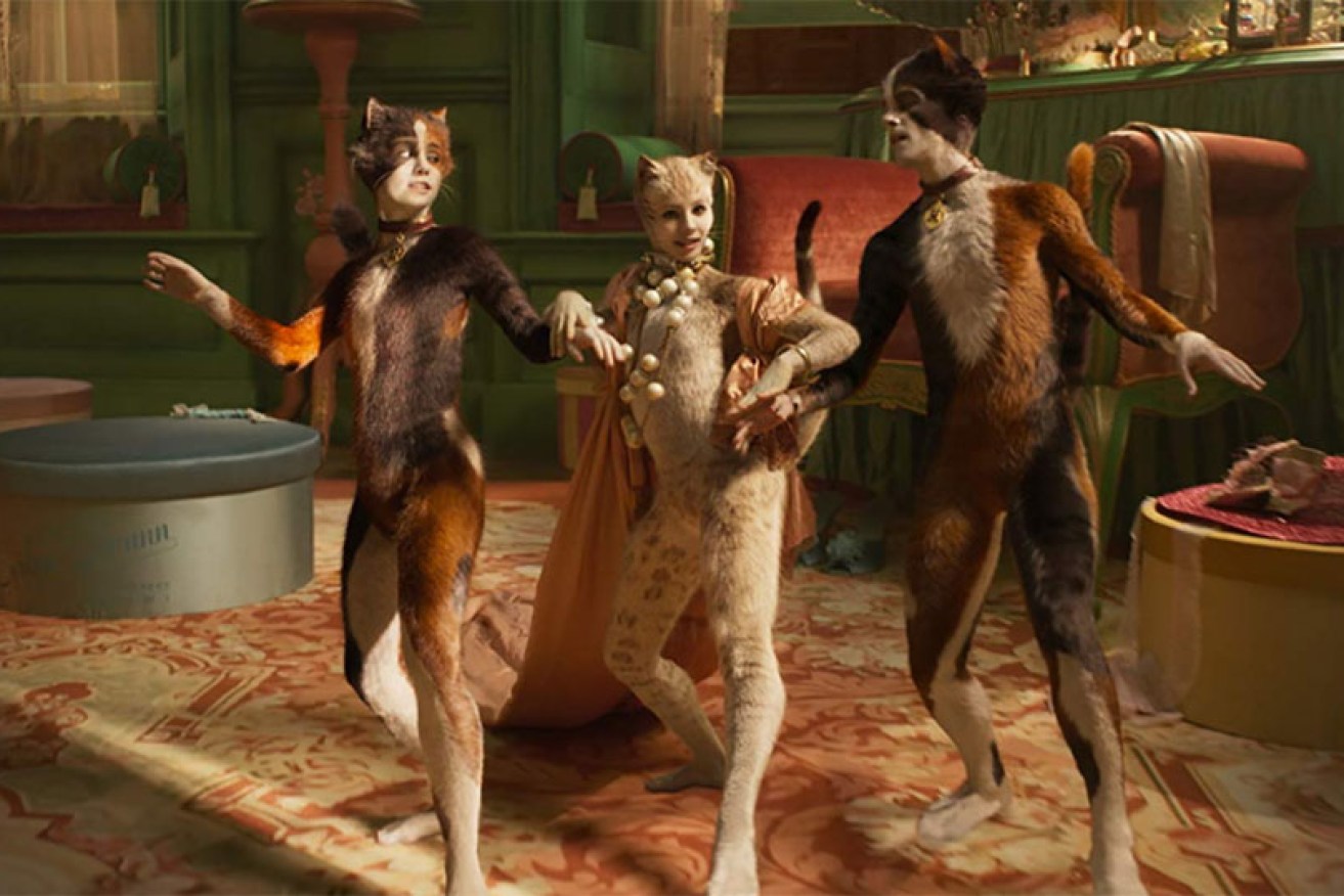 Britain's Royal Ballet star Francesca Hayward (centre) grates with her plaintive stares in <i>Cats.</i>