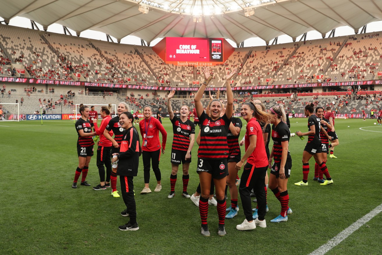 The Wanderers women celebrate their big win on Friday night. 