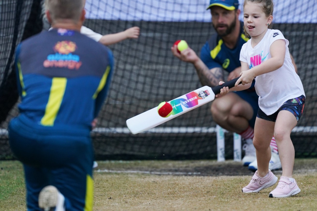 Just like Dad: David Warner's daughter   Ivy Mae during an Australia cricket team training session at the MCG on Wednesday. 