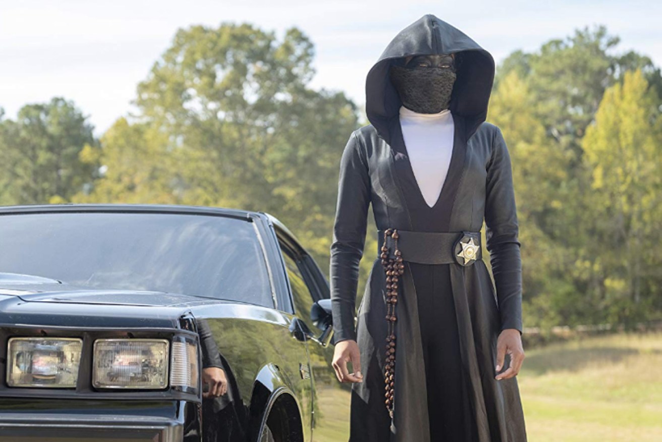 Regina King fights racist in a black leather nun uniform as Sister Night in <i>Watchmen.</i>