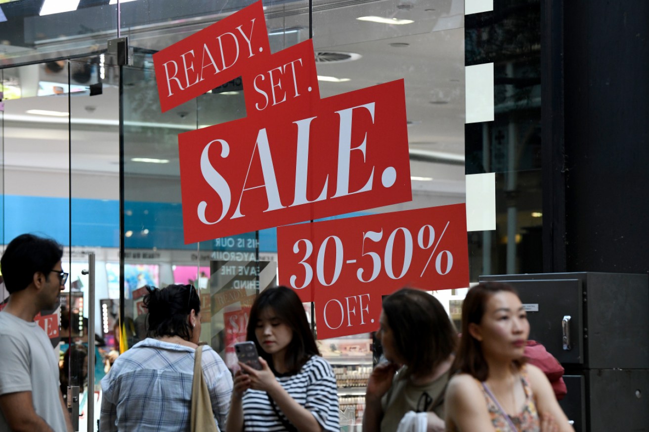 Shoppers lured to Sydney's Pitt Street with the promise of Boxing Day bargains. 