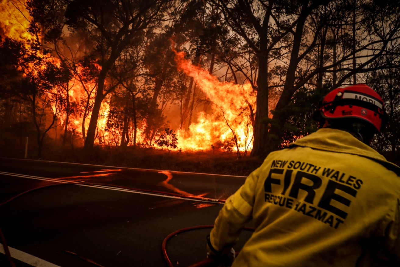 The RFS is working to maintain control of a NSW fire that's claimed one life, and destroyed homes.