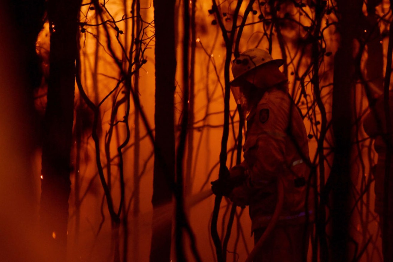 Exhausted firefighters are bracing for high temperatures, strong winds and the threat of new fires.