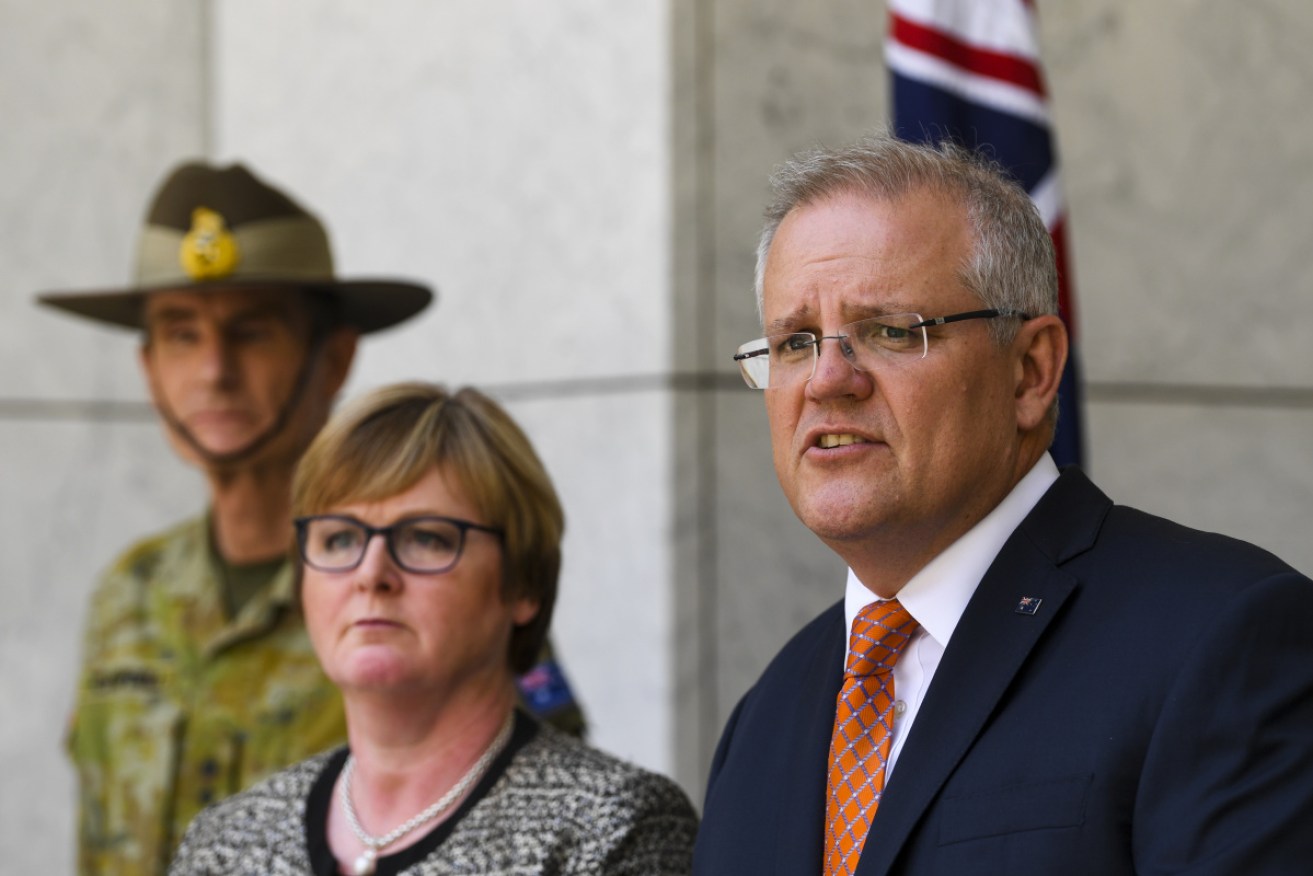 PM Scott Morrison alongside Defence Minister Linda Reynolds and ADF chief Angus Campbell.