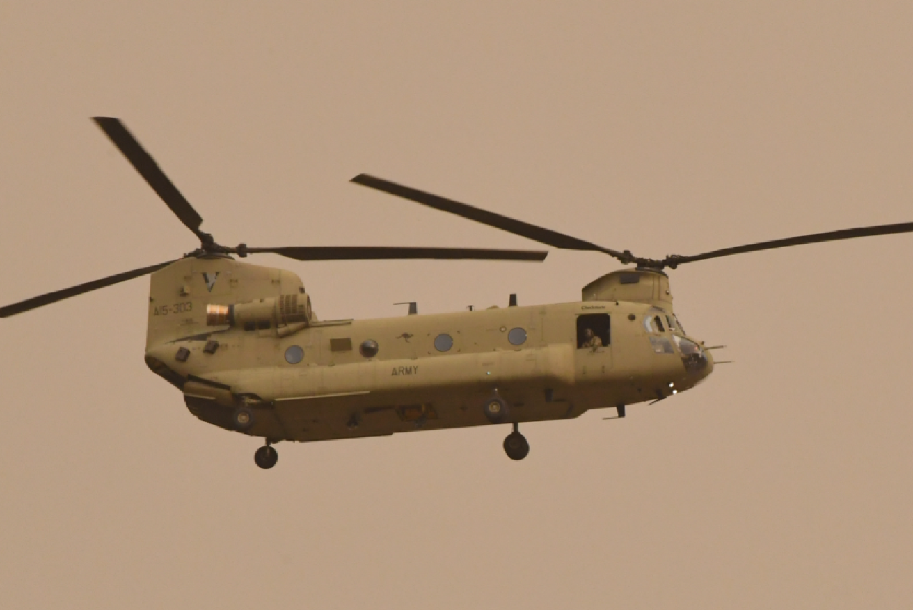 A Chinook helicopter lifts climate refugees from fire-besieged Omeo to safety.