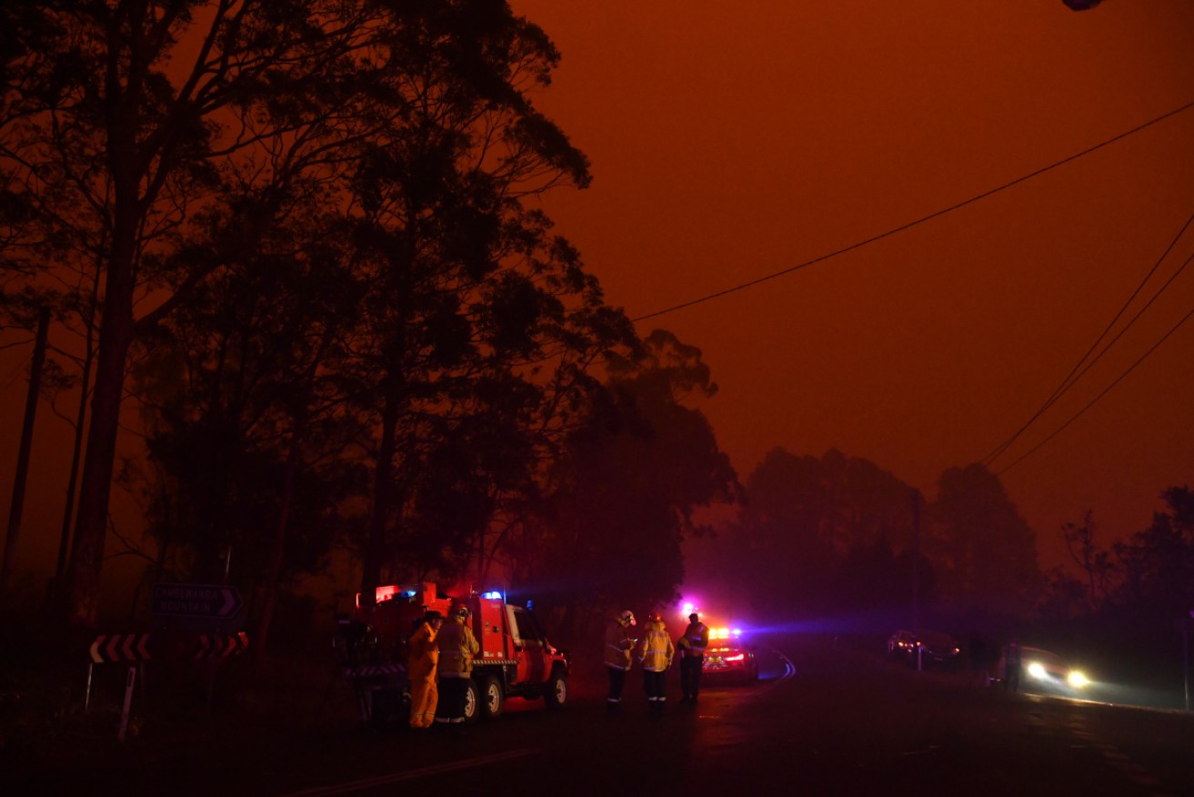 As darkness fell across the country, many crews were pulled back from blazes that were deemed 'too dangerous' to continue fighting.