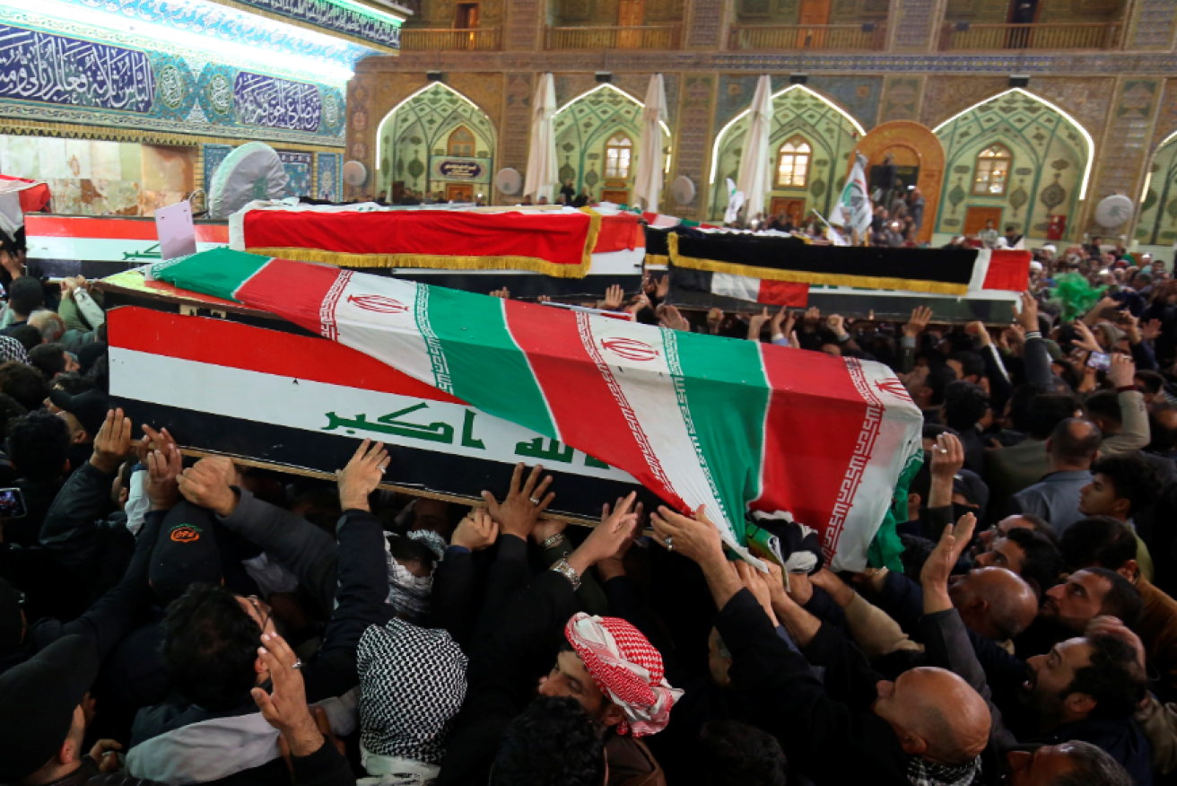Mourners demand revenge on the US as they carry the remains of Qassem Soleimani.