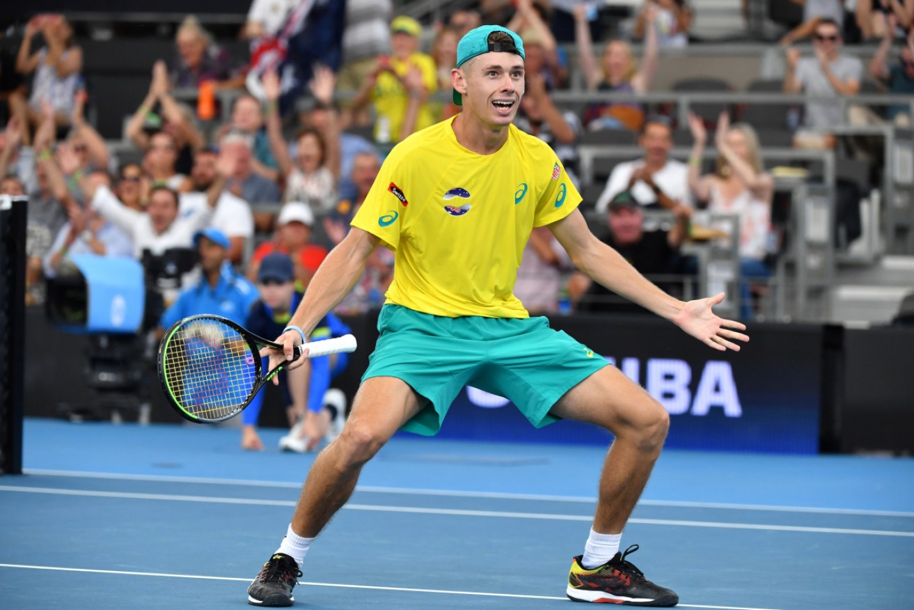 Alex de Minaur of Australia celebrates winning his match against Denis Shapovalov of Canada.