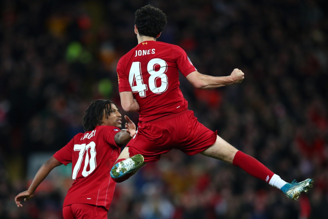 Curtis Jones of Liverpool celebrates scoring the winner against Everton.