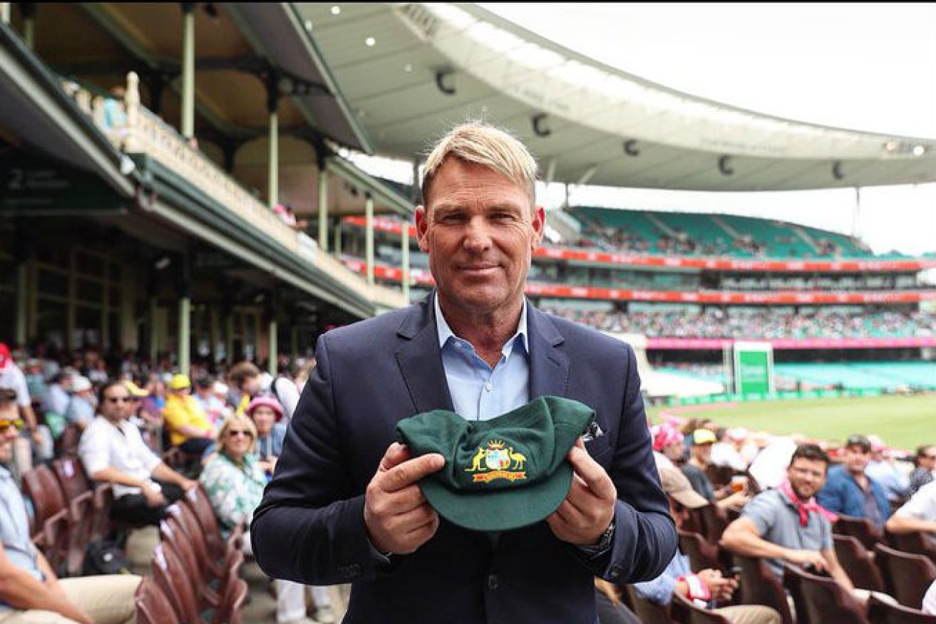 Shane Warne is urging people to bid on his baggy green to raise money for the bushfire appeal.