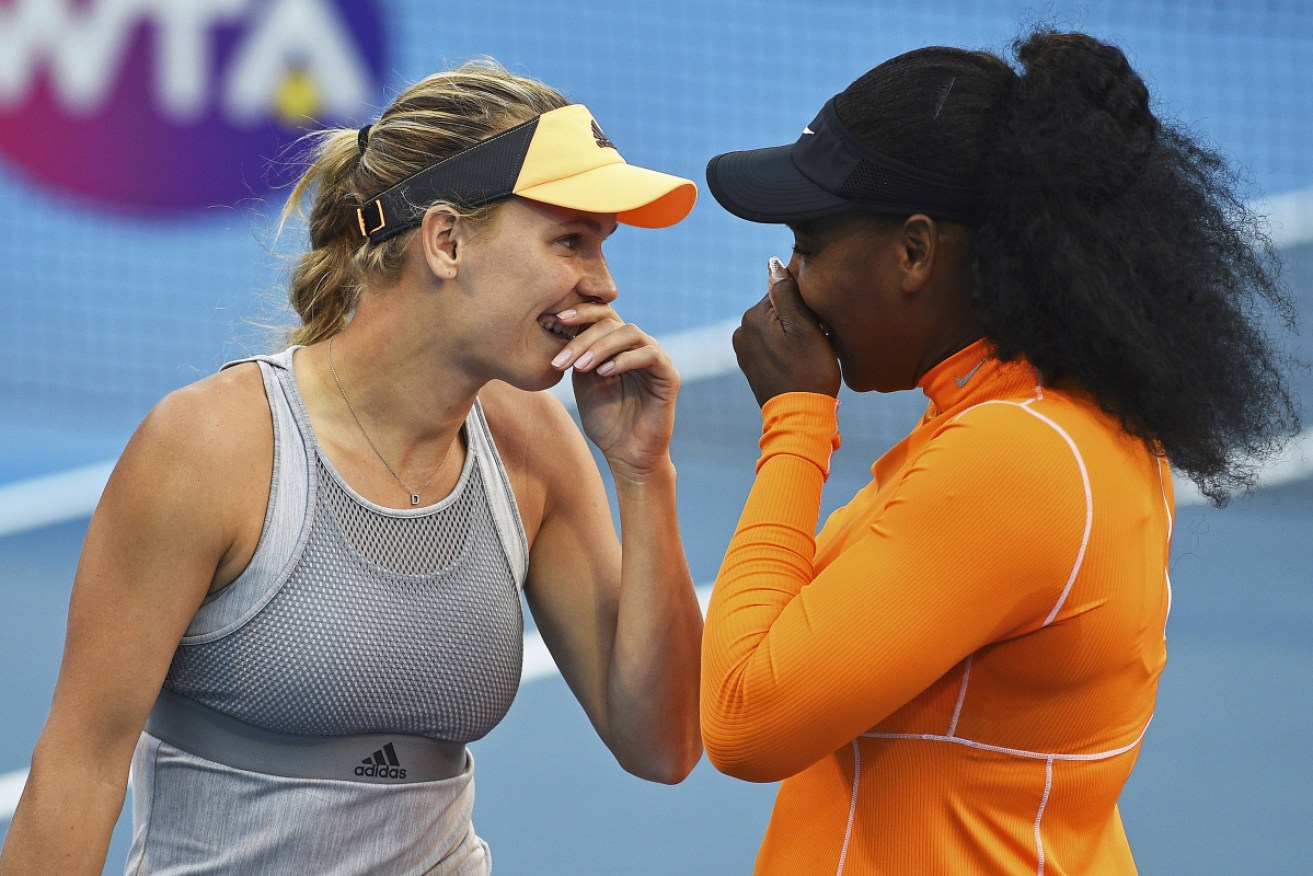 Denmark's Caroline Wozniacki, left, and Serena Williams have won their first round doubles match against Japan's Nao Hibino and Makoto Ninomiya at the ASB Classic in Auckland, New Zealand.