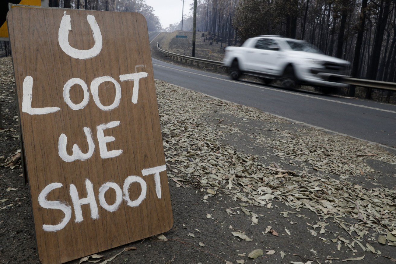 A roadside sign in Conjalo makes it clear what the locals think of looting.