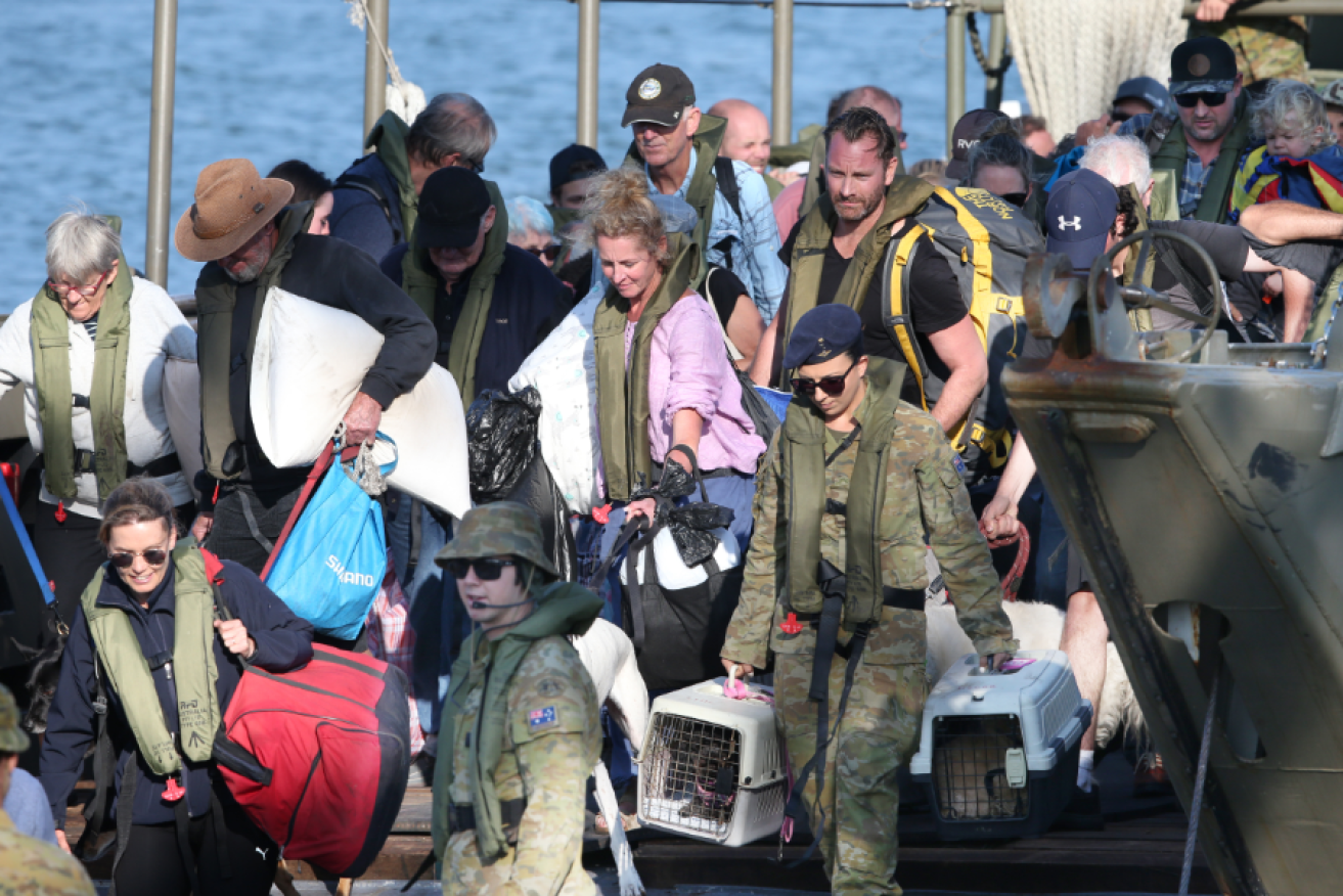 Travel-weary but safe at last, the last Mallacoota's fire refugees step ashore at Western Port.