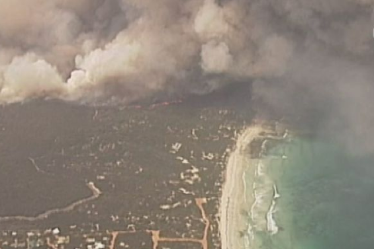 Flames lay siege to Kangaroo Island's Vivonne Bay late  on Thursday afternoon.