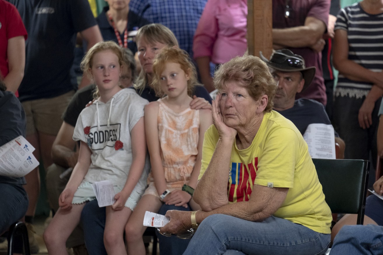Children from Clifton Creek in Victoria attend a community meeting as the state remains on high bushfire alert. 