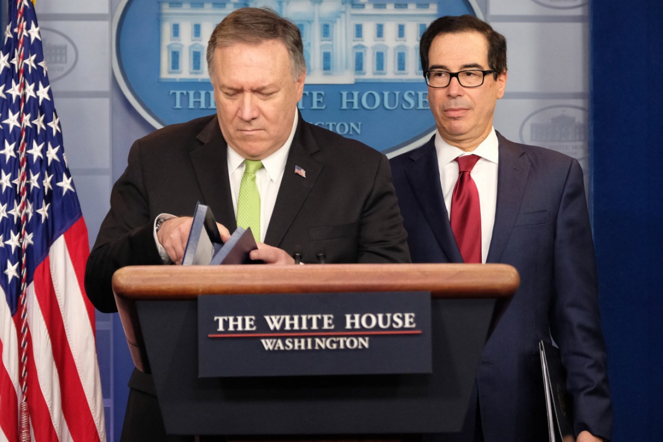 US Secretary of State Mike Pompeo with Secretary of the Treasury Steven Mnuchin in the White House press briefing room on Saturday (AEDT).