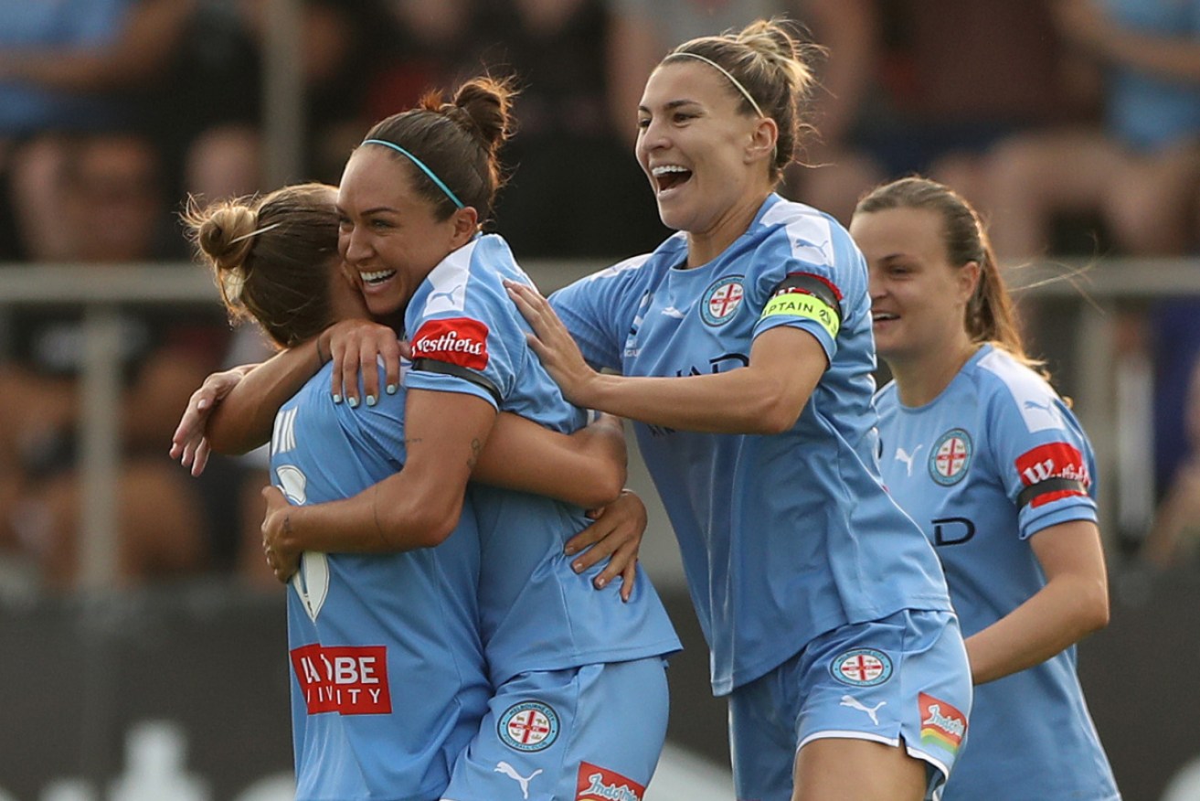 Kyah Simon (C) and her Melbourne City teammates celebrate another goal.