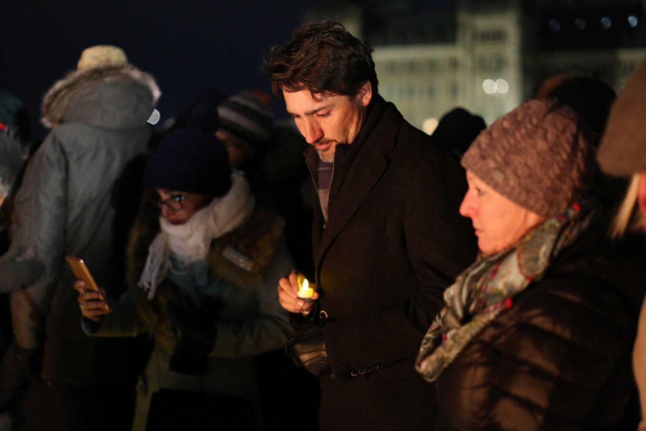 Justin Trudeau attends a vigil for the victims killed after Iran accidentally downed a Ukrainian airliner, killing all 176 people on board.