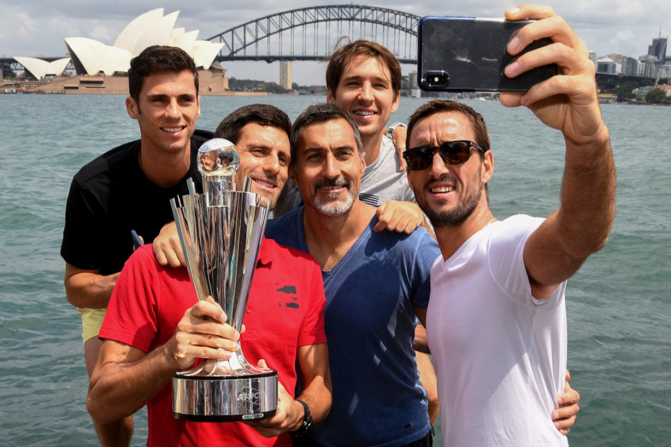 Team Serbia (L-R) Nikola Milojevic, Novak Djokovic, captain Nenad Zimonjic, Dusan Lajovic and Viktor Troicki pose for a photograph on Sydney Harbour. 
