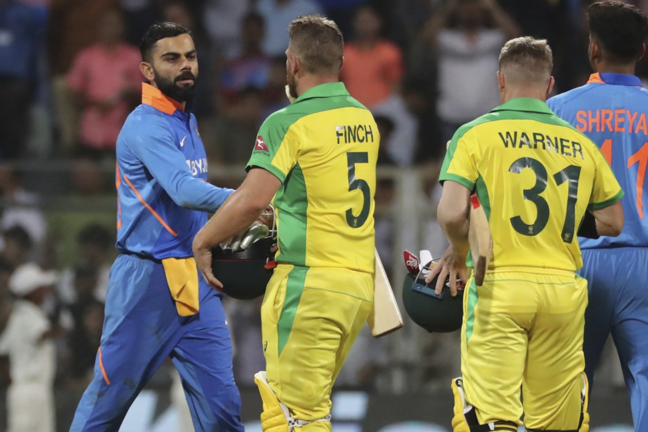 Australia's captain Aaron Finch is congratulated by Indian captain Virat Kohli.