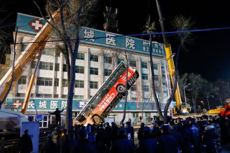 Six killed as sinkhole opens in China street