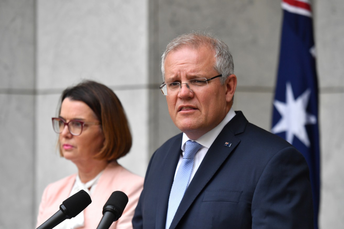 Prime Minister Scott Morrison, flanked by Minister for Families Anne Ruston, announces the assistance package.