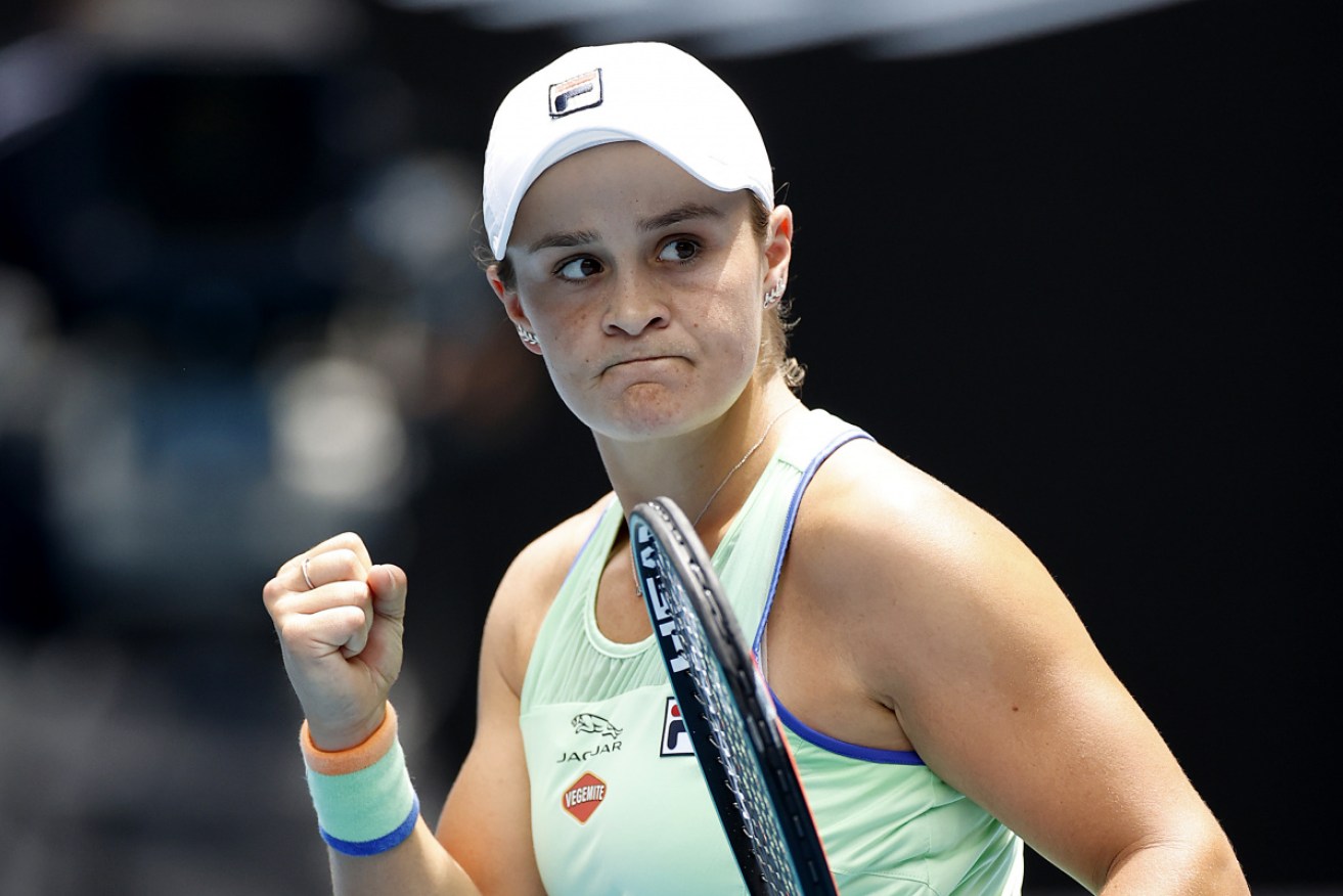 Ash Barty celebrates after a straightforward second round triumph on Rod Laver Arena.