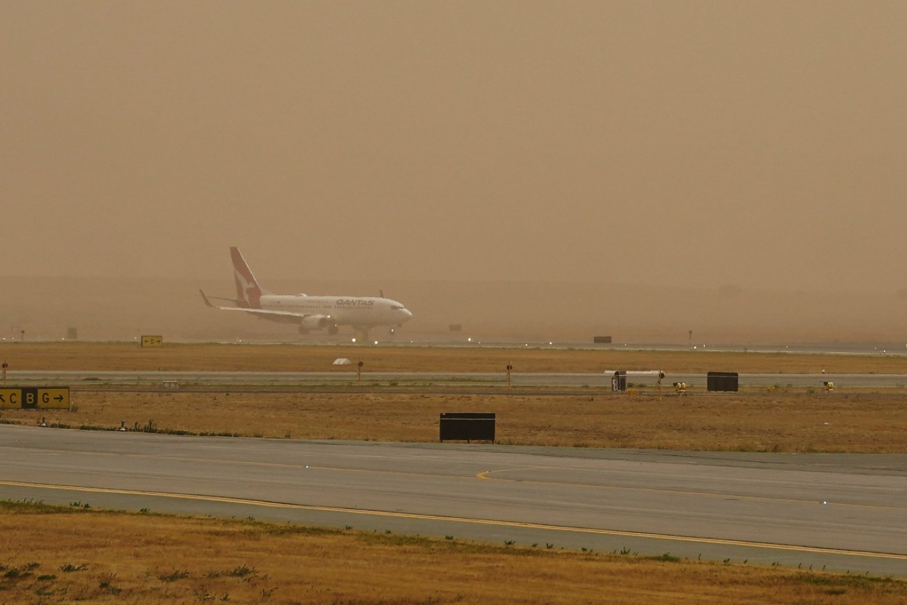 The fire grounded all flights to and from Canberra Airport, and threatened nearby homes.