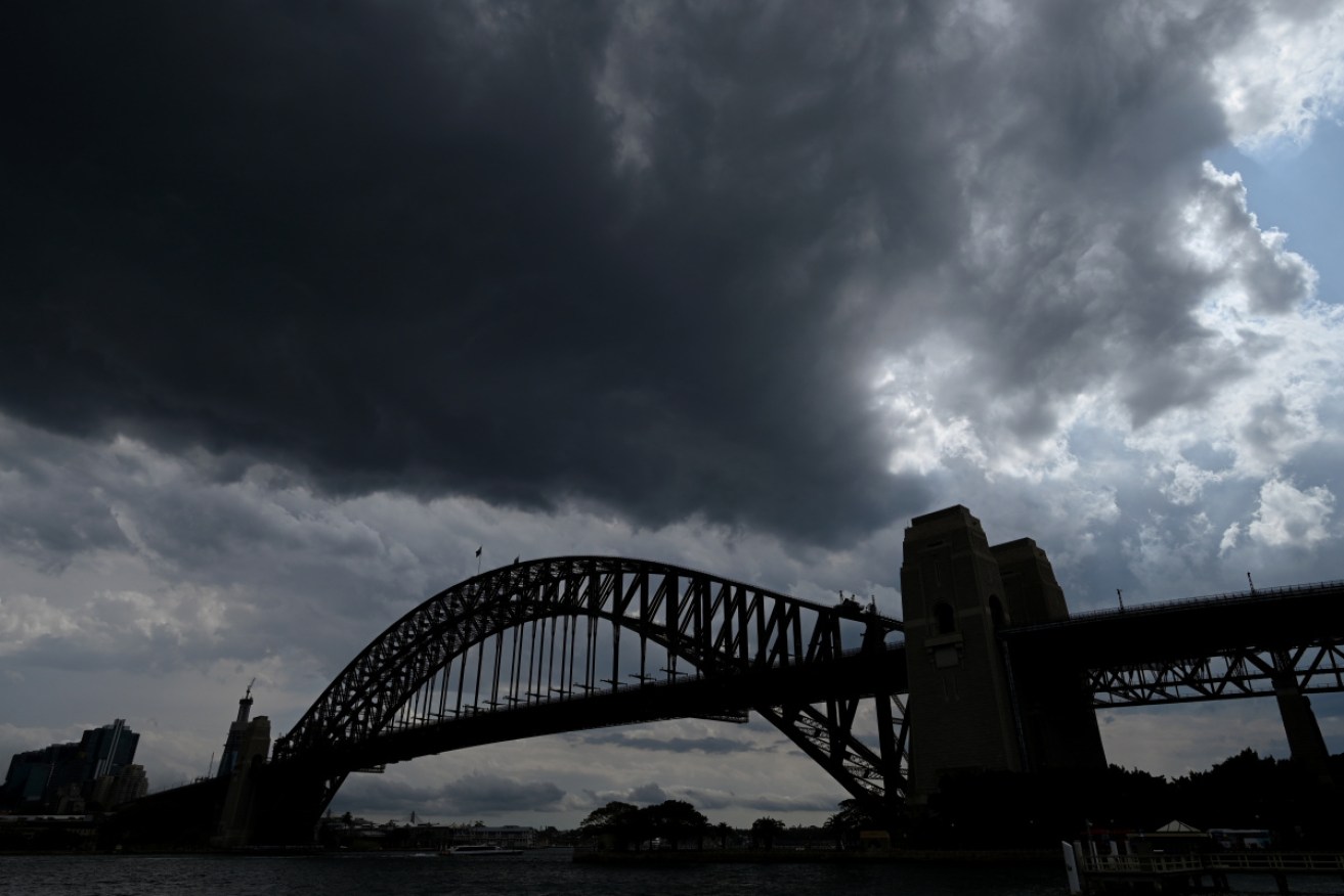 Sydneysiders battled another day of dust, hail, thunderstorms and transport delays.