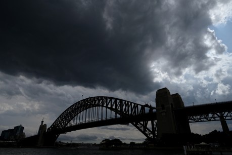 Wild weather hits Sydney with more smoky days to come