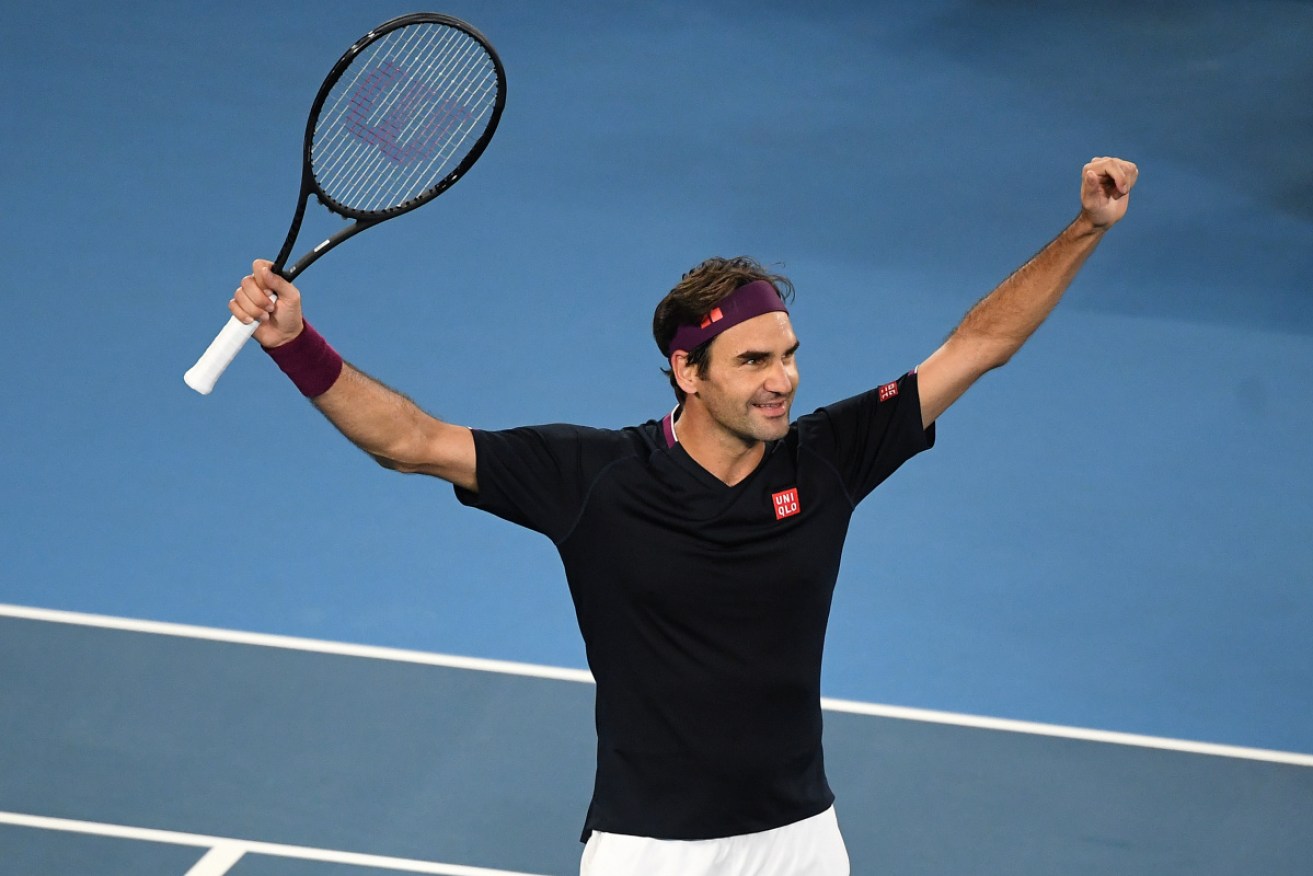 Made it: Roger Federer celebrates his escape against John Millman. 