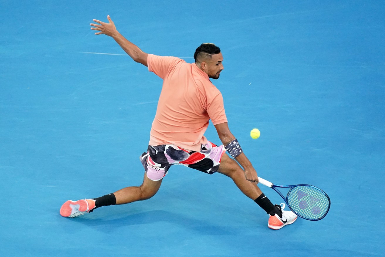 Nick Kyrgios shows his style on his way to a win on Saturday night. 