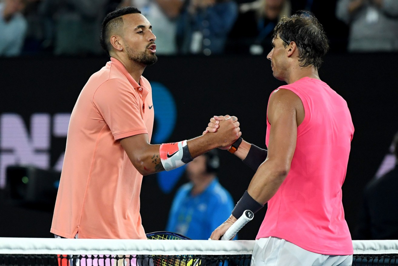 A classic: Nick Kyrgios and Rafael Nadal meet at the net after their four-set match on centre court.