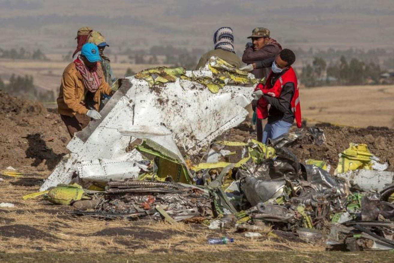 Rescuers work at the scene of the Ethiopian Airlines 737 MAX 8 crash south of Addis Ababa, Ethiopia, which killed 157 people. <i>Photo: via ABC News</i>