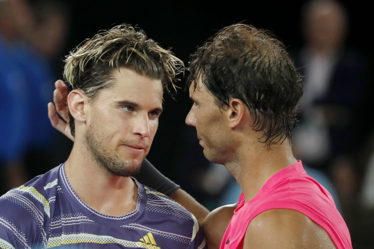Dominic Thiem is congratulated by Rafael Nadal after his stunning upset on Wednesday night.  