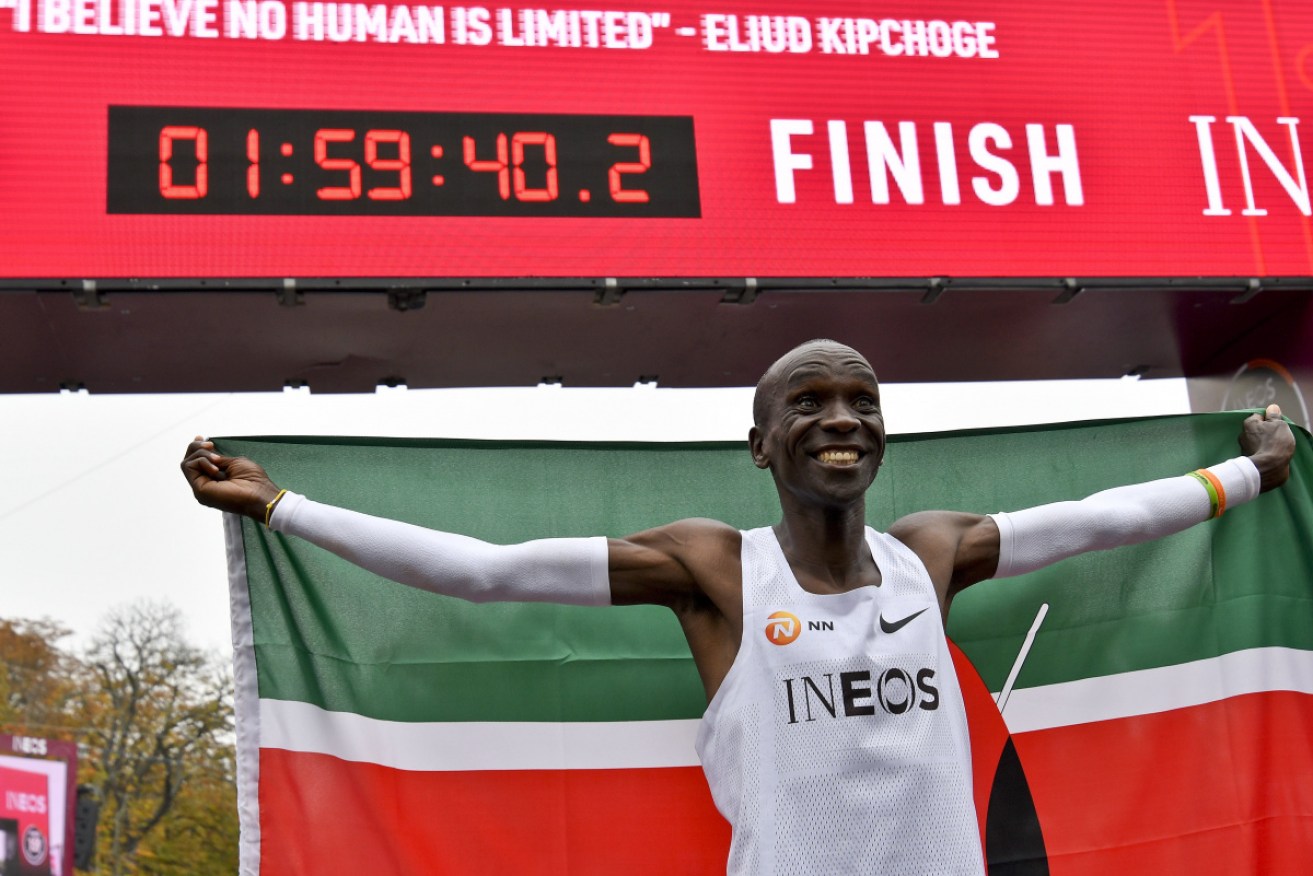 Kenya's Eliud Kipchoge celebrates after breaking the two-hour barrier for the marathon in October.