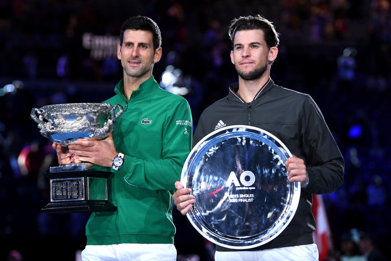 That would be No.8: Novak Djokovic with the winners trophy and Dominic Thiem with his plate. 