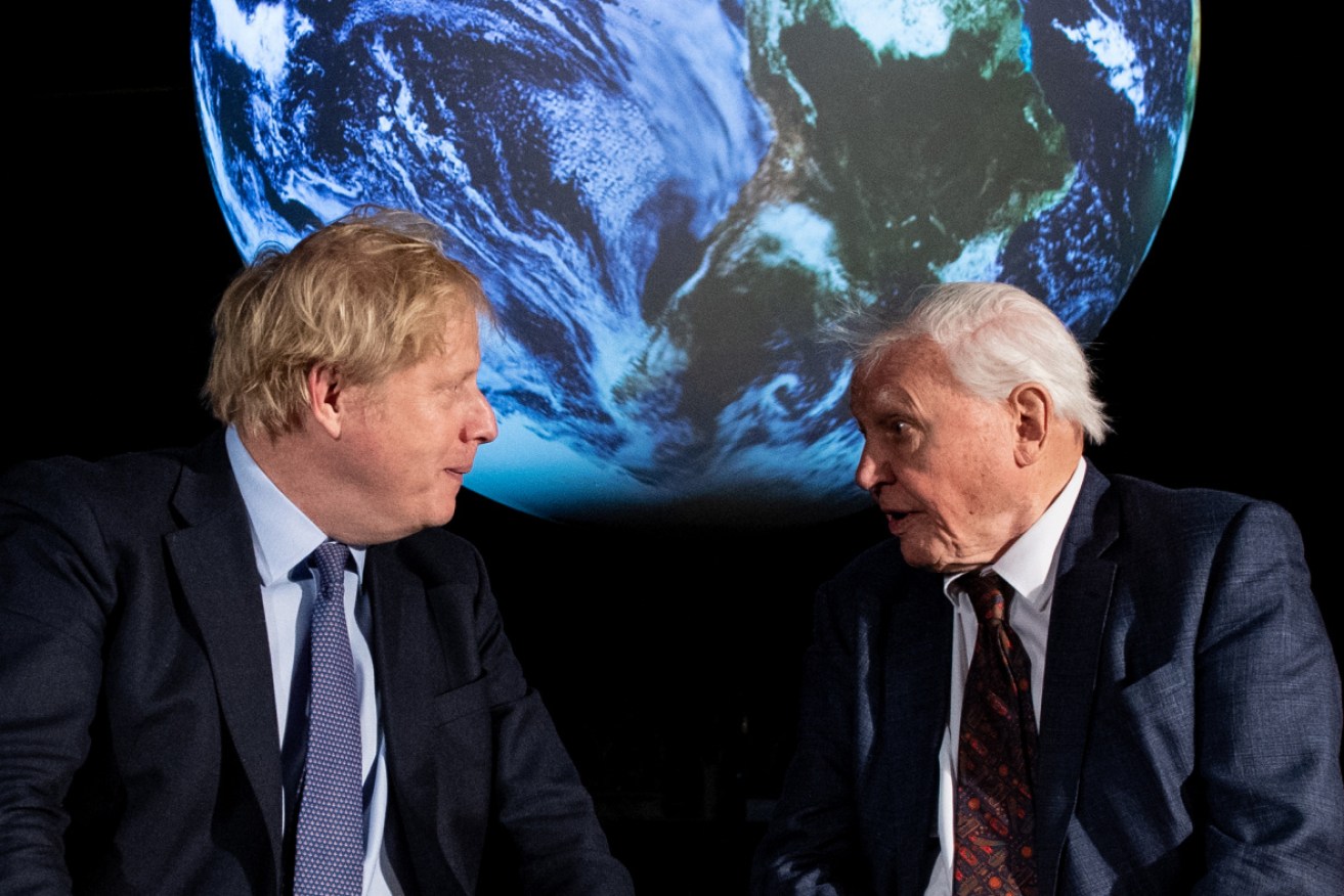 British Prime Minister Boris Johnson (L) speaks with British broadcaster and naturalist Sir David Attenborough during the launch of the UK-hosted COP26 UN Climate Summit.