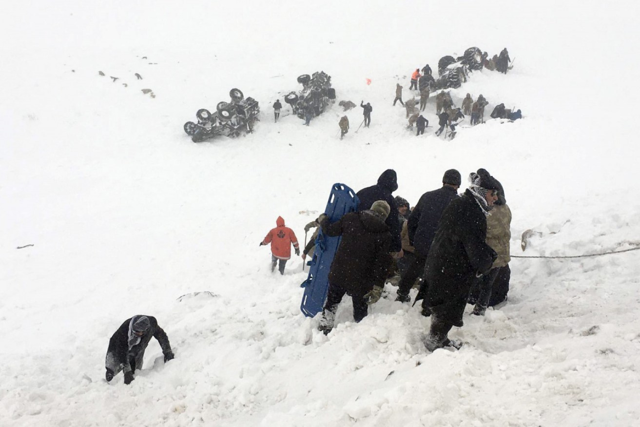 Work continues to rescue 25 people buried under an avalanche in
Turkey's Bahcesaray district.